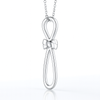 Round Diamond Ribbon Twist Cross Pendant